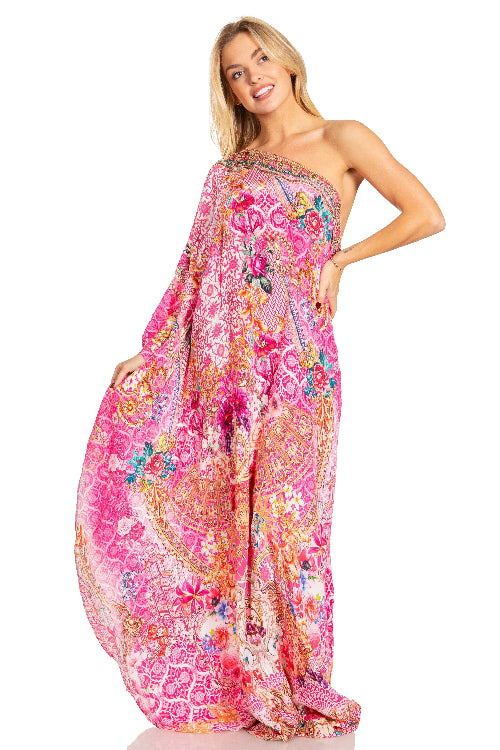 Woman wearing a colorful floral dress on a white background