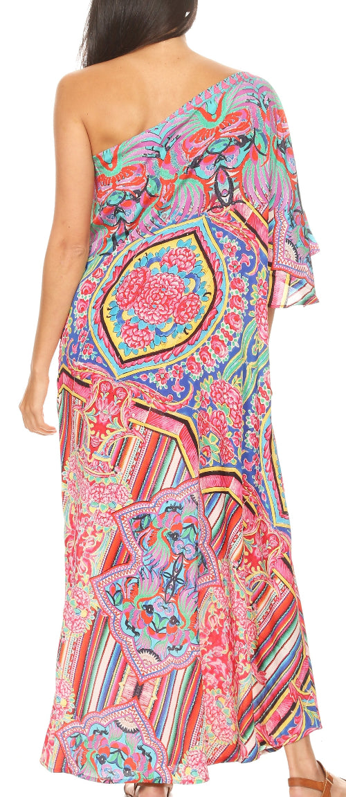 Woman wearing a colorful one-shoulder dress with a geometric pattern.