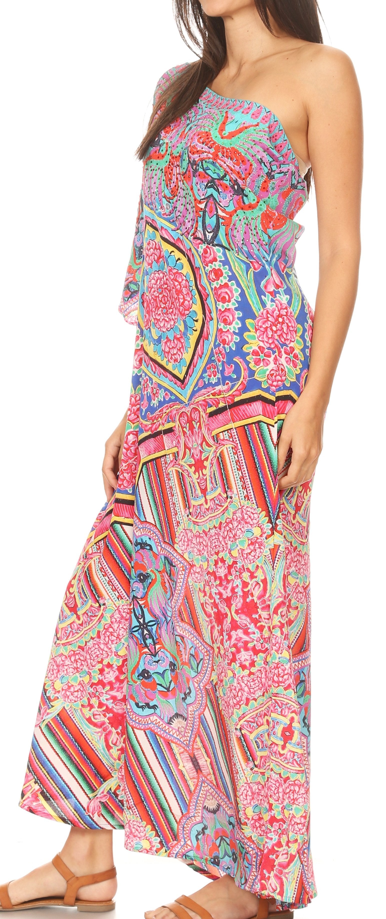Woman wearing a colorful strapless dress with a pattern on a white background