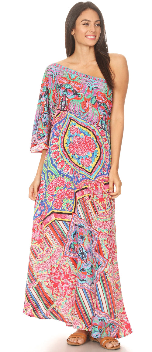 Woman wearing a colorful one-shoulder dress with a floral pattern on a white background