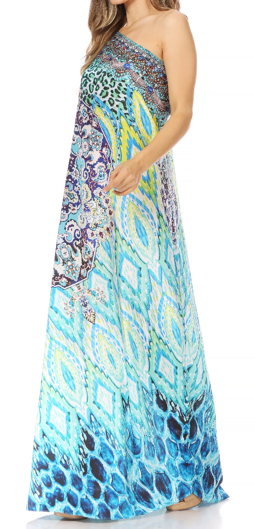 Woman wearing a colorful one-shoulder dress with geometric pattern on a white background