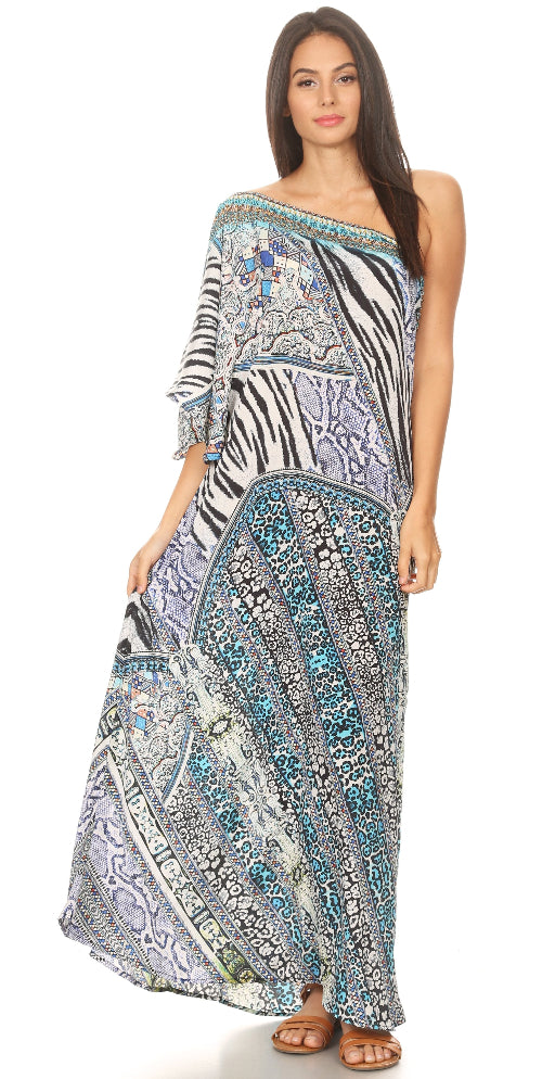 Woman wearing a patterned one-shoulder dress on a white background