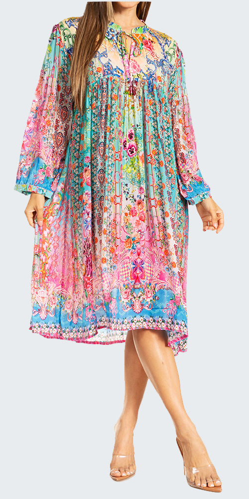 Woman wearing a colorful floral dress on a white background
