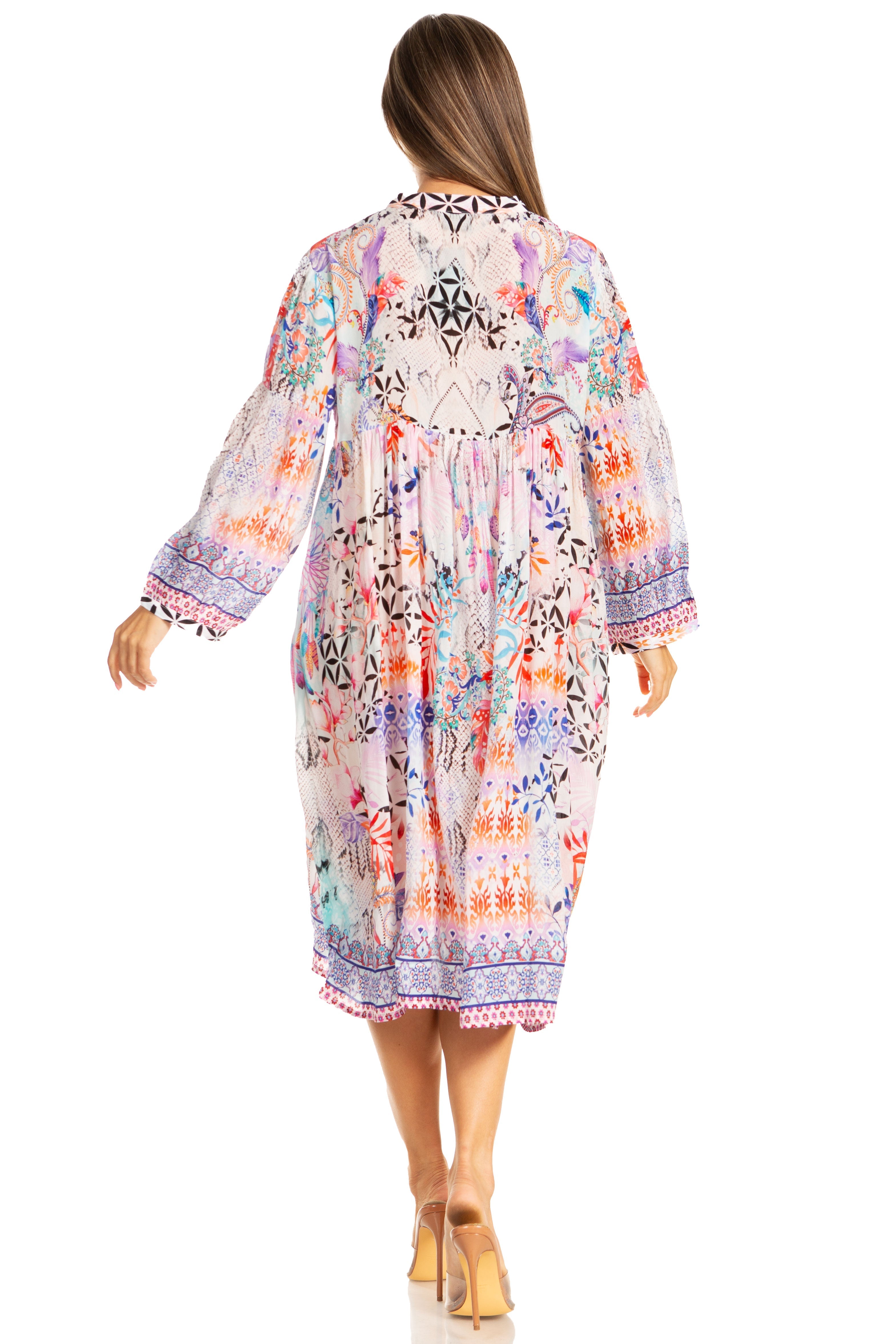 Woman wearing a colorful floral dress on a white background