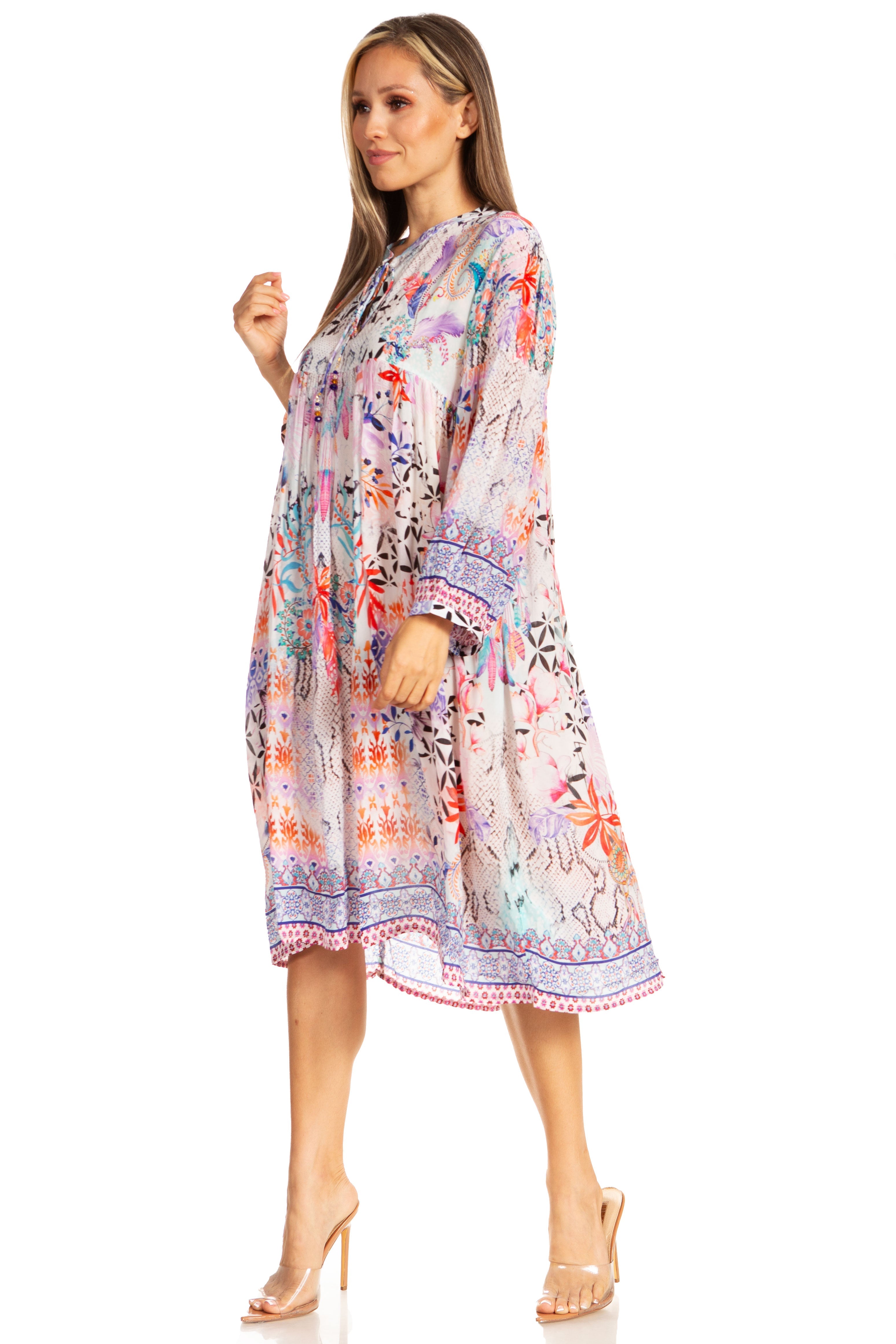 Woman wearing a colorful floral dress on a white background
