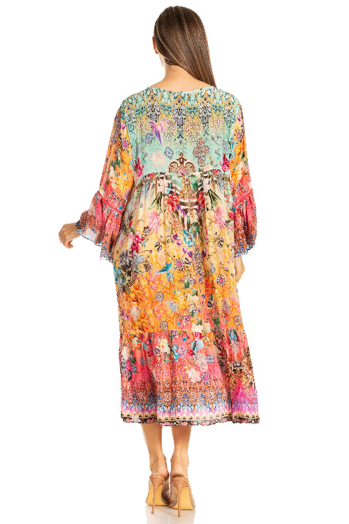 Woman wearing a colorful floral dress on a white background