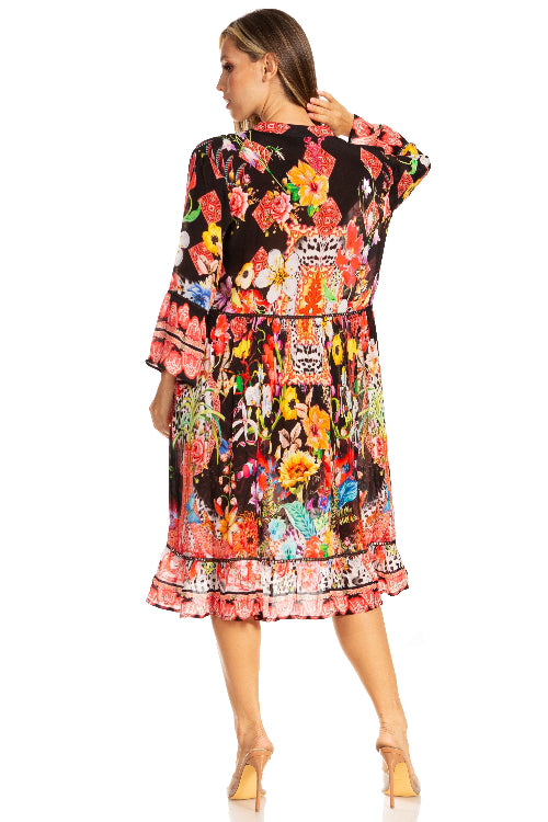 Woman wearing a colorful floral dress on a white background