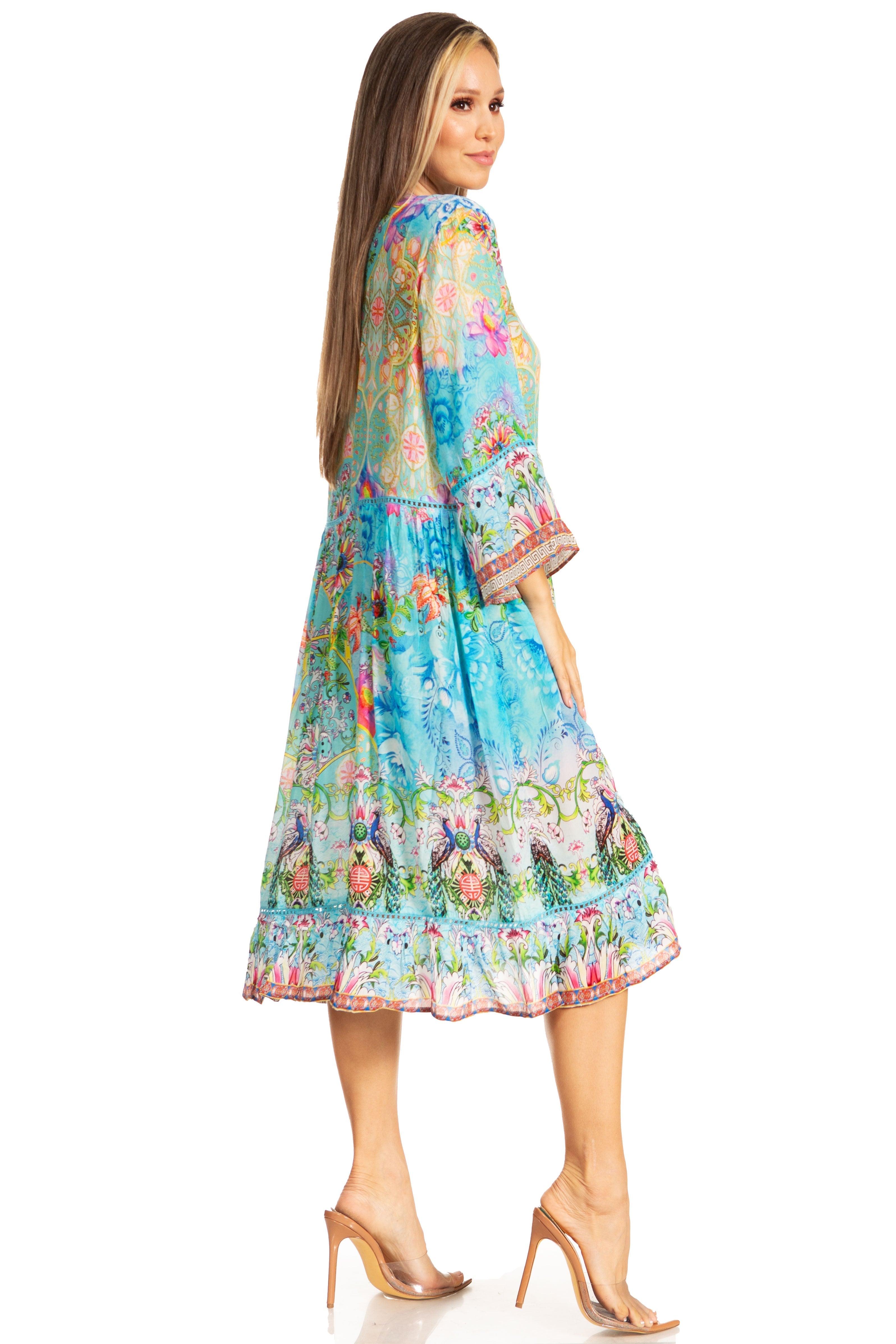 Woman wearing a colorful floral dress on a white background