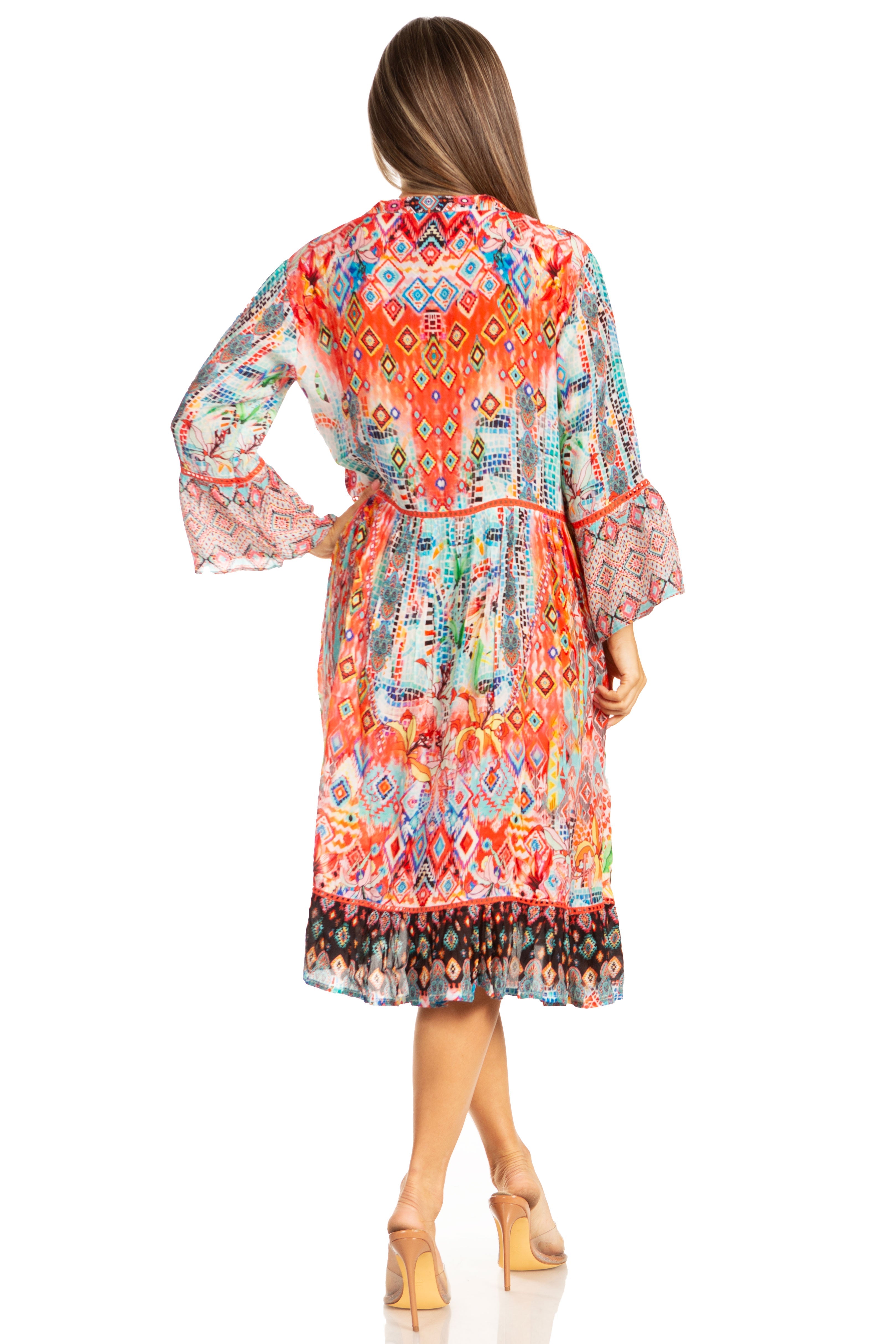 Woman wearing a colorful patterned dress on a white background