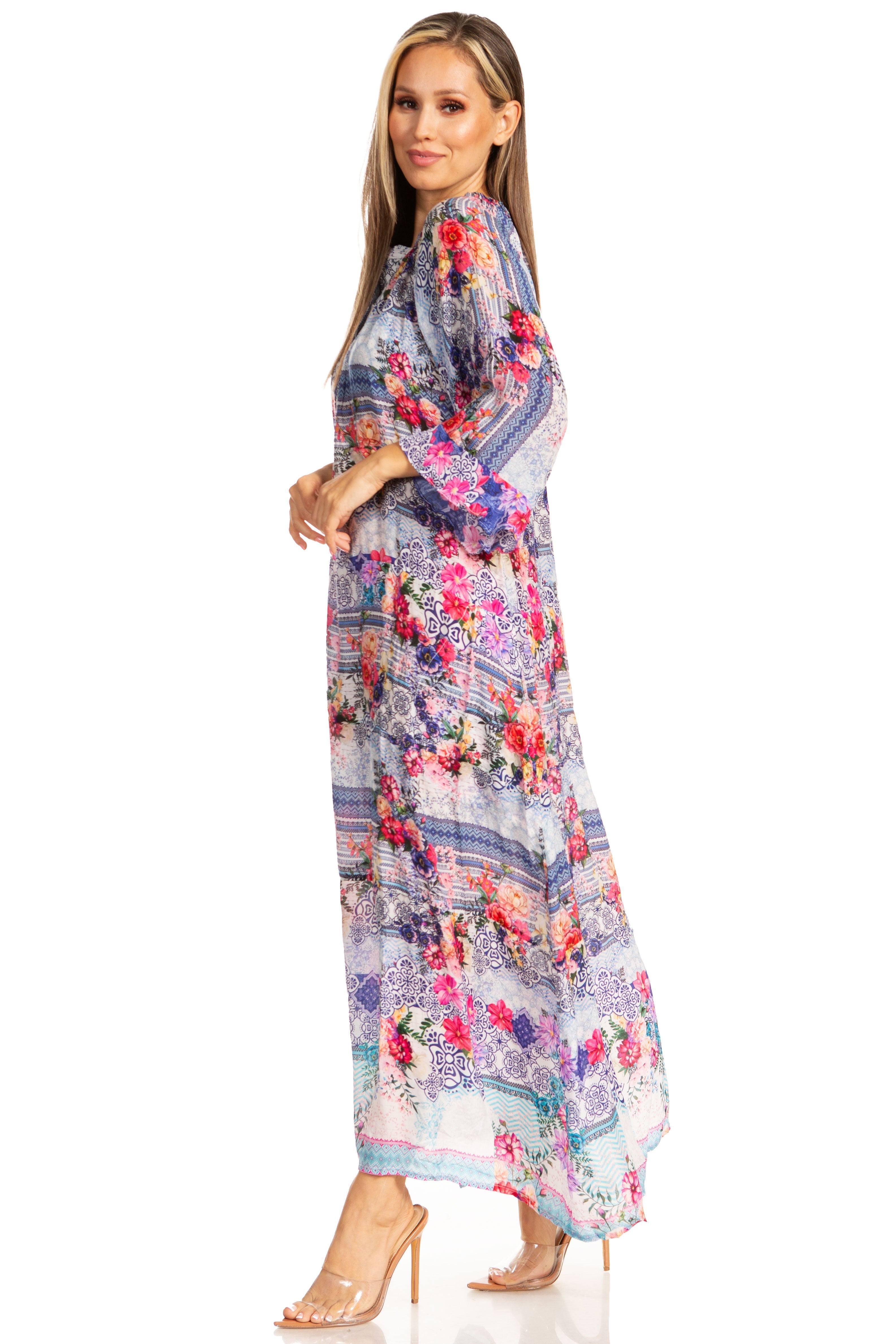 Woman wearing a long floral dress on a white background