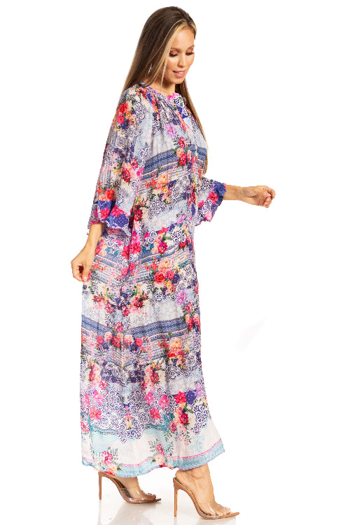 Woman wearing a long floral dress on a white background
