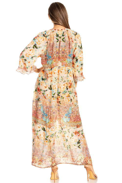 Woman wearing a floral dress with long sleeves on a white background