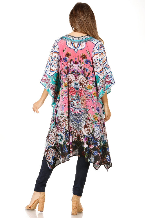 Woman wearing a colorful floral kimono-style garment on a white background