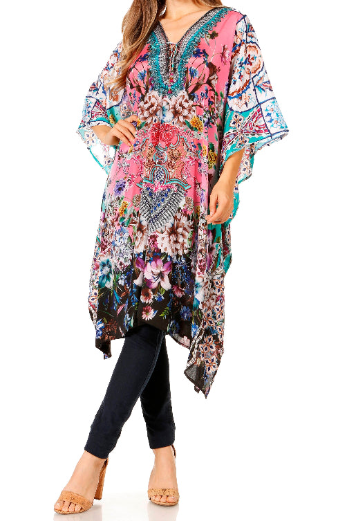 Woman wearing a colorful floral kimono-style garment on a white background
