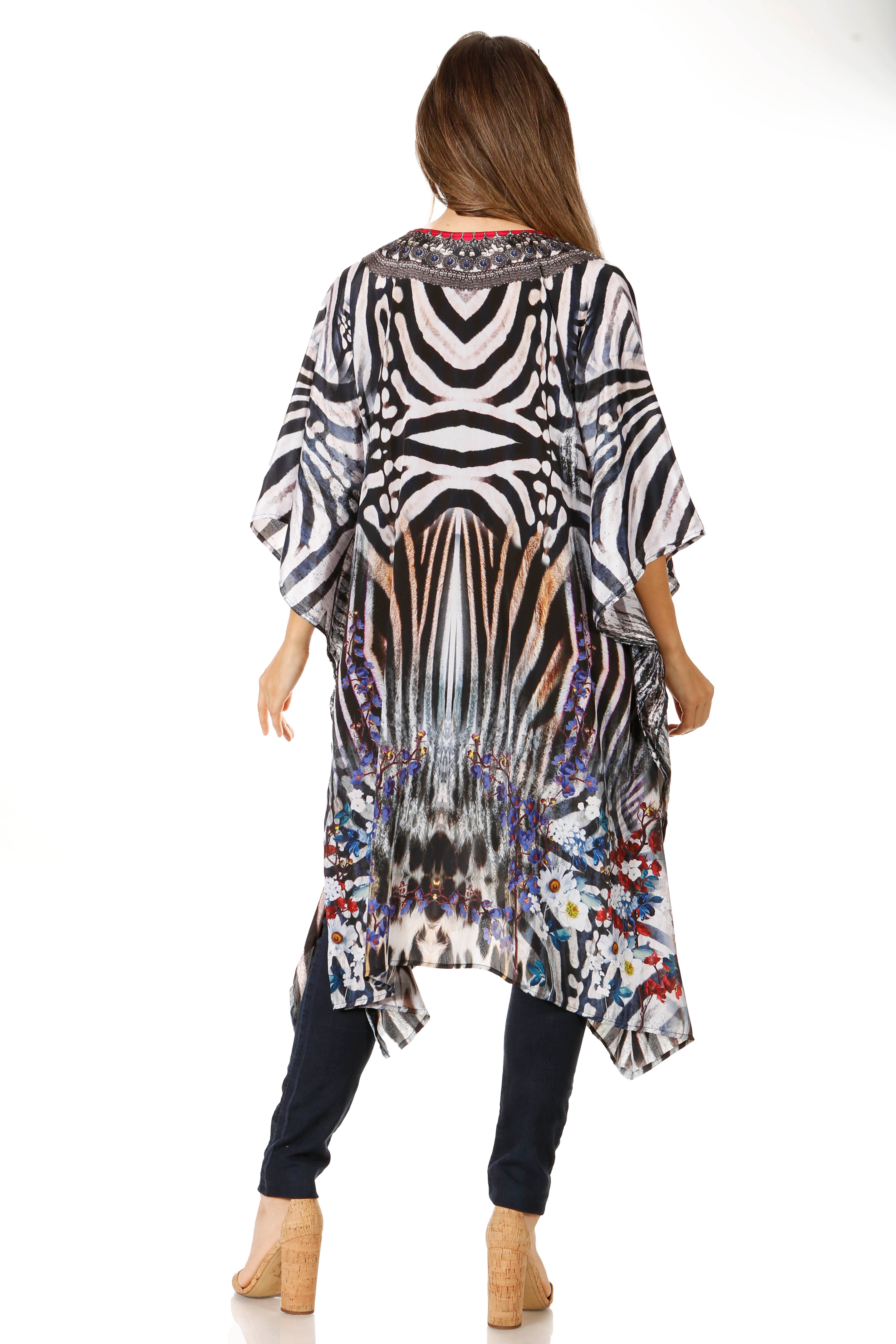 Woman wearing a colorful, patterned dress with a zebra print overlay on a white background