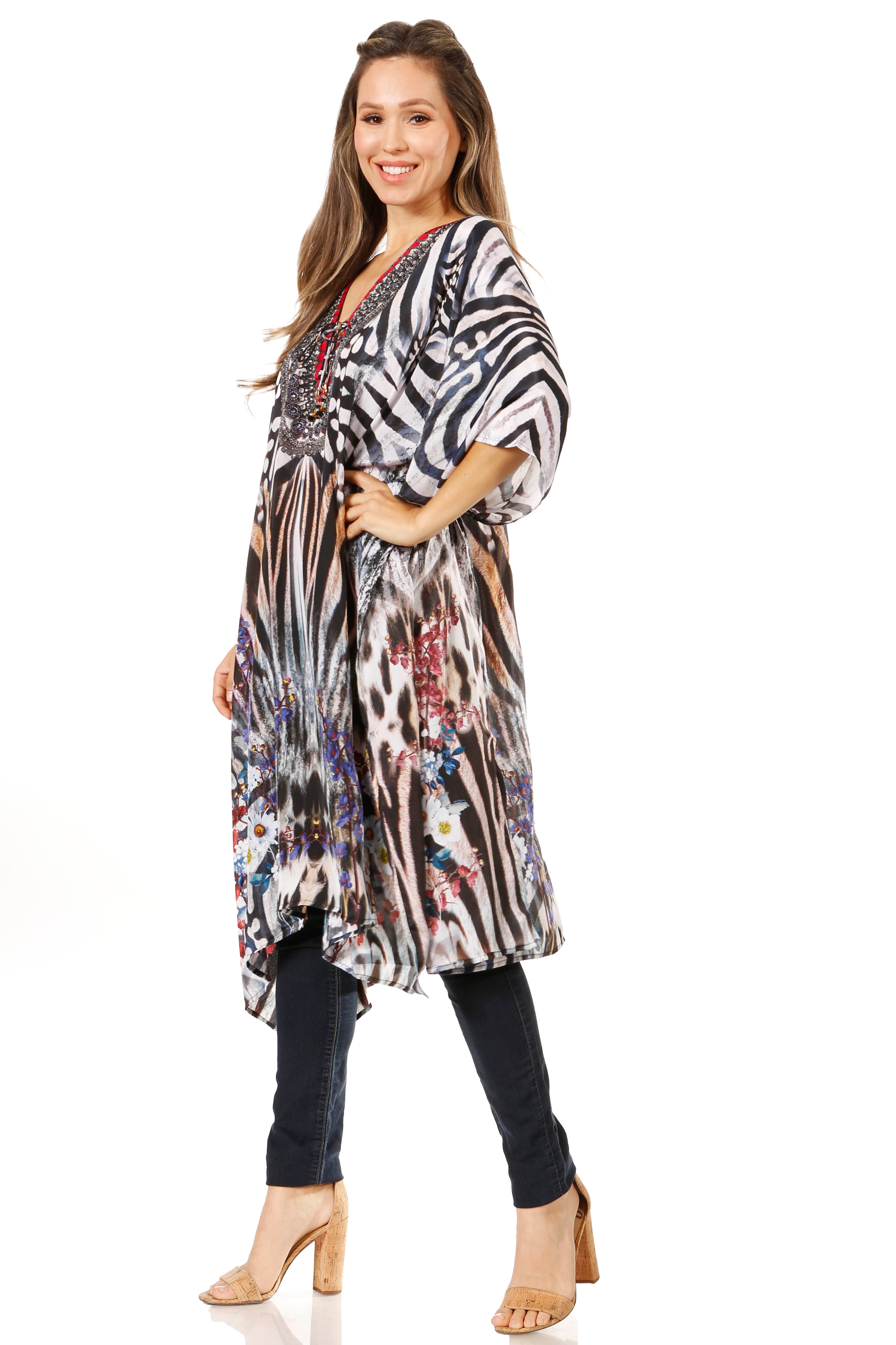 Woman wearing a long, patterned kimono-style garment on a white background