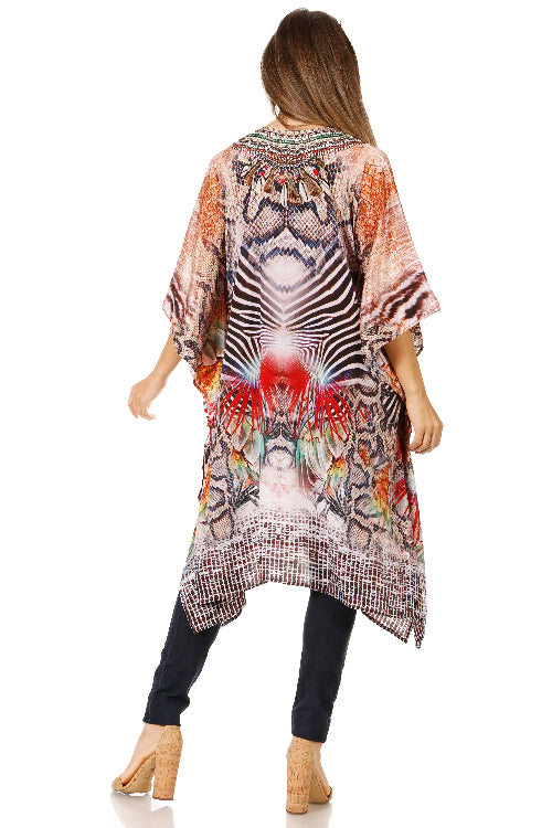 Woman wearing a colorful kimono-style garment with abstract patterns on a white background