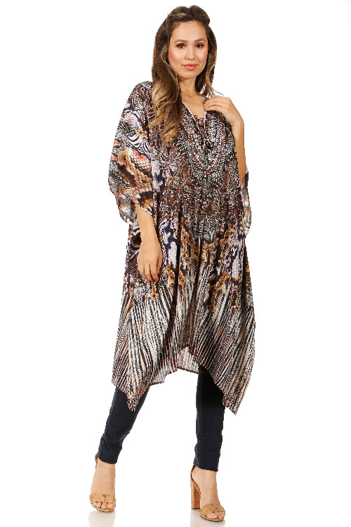Woman wearing a patterned long top and black leggings on a white background