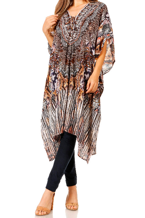 Woman wearing a patterned long top over black leggings on a white background