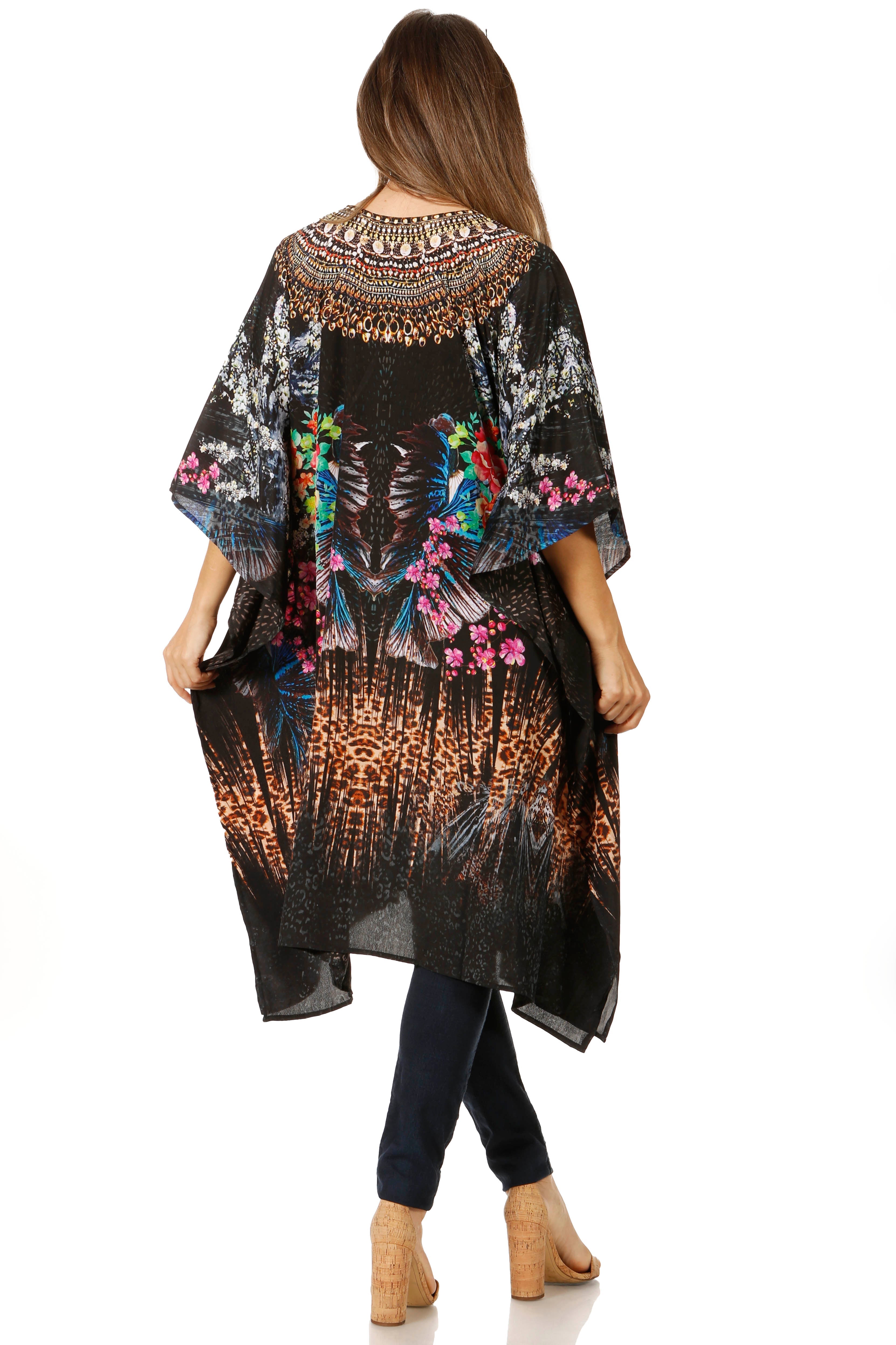 Woman wearing a black floral kimono-style garment on a white background