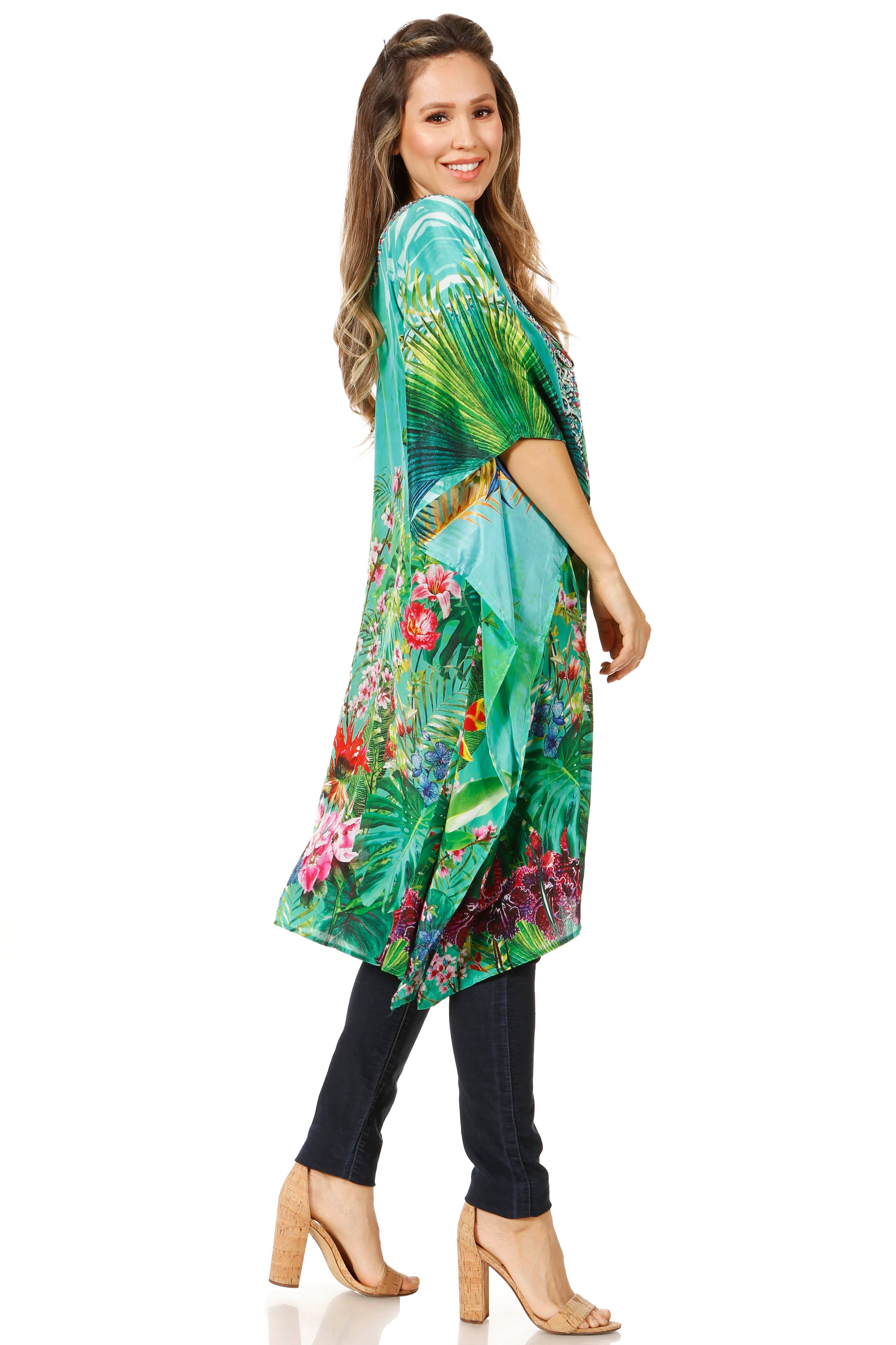 Woman wearing a colorful floral kimono-style garment on a white background