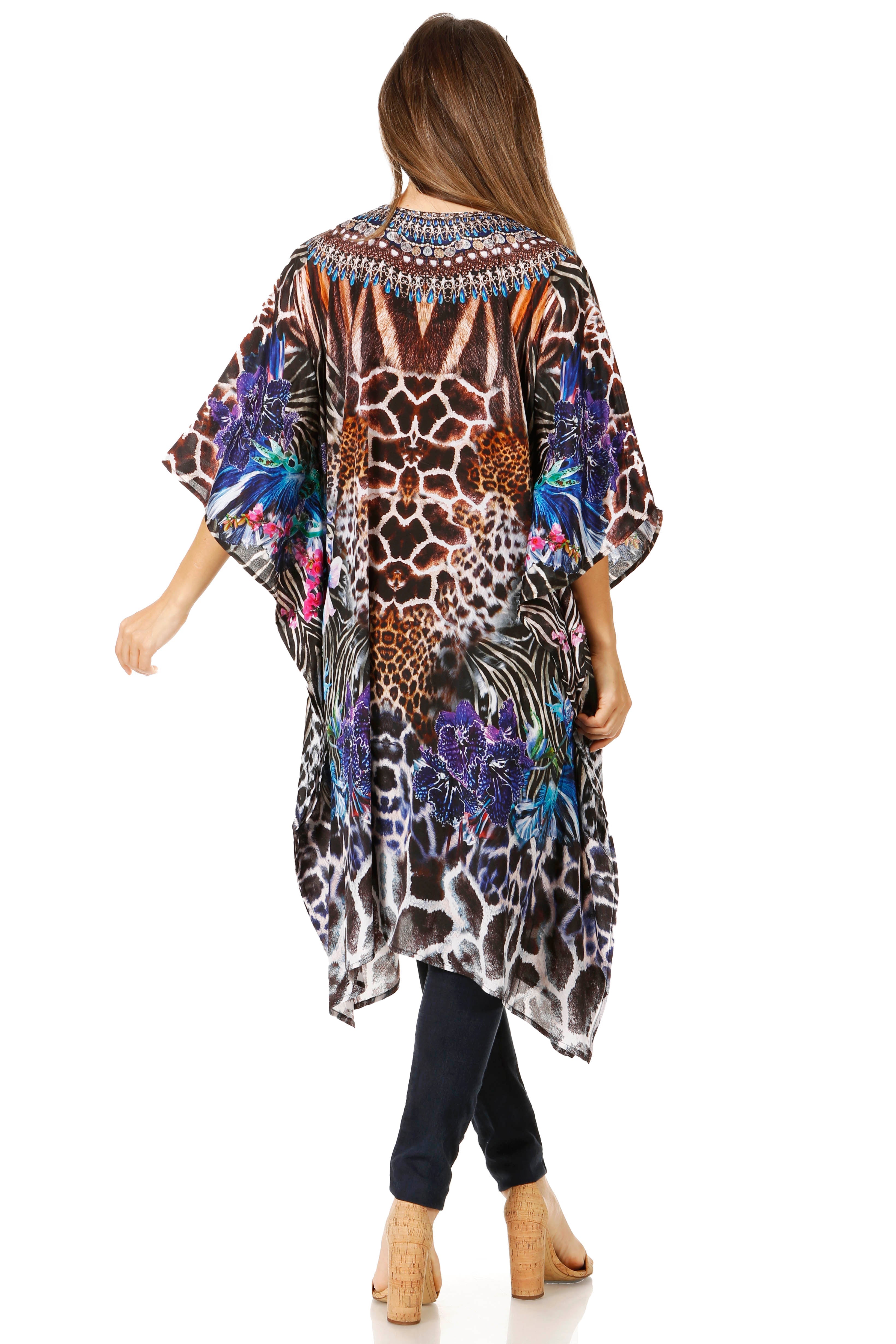 Woman wearing a colorful animal print kimono on a white background