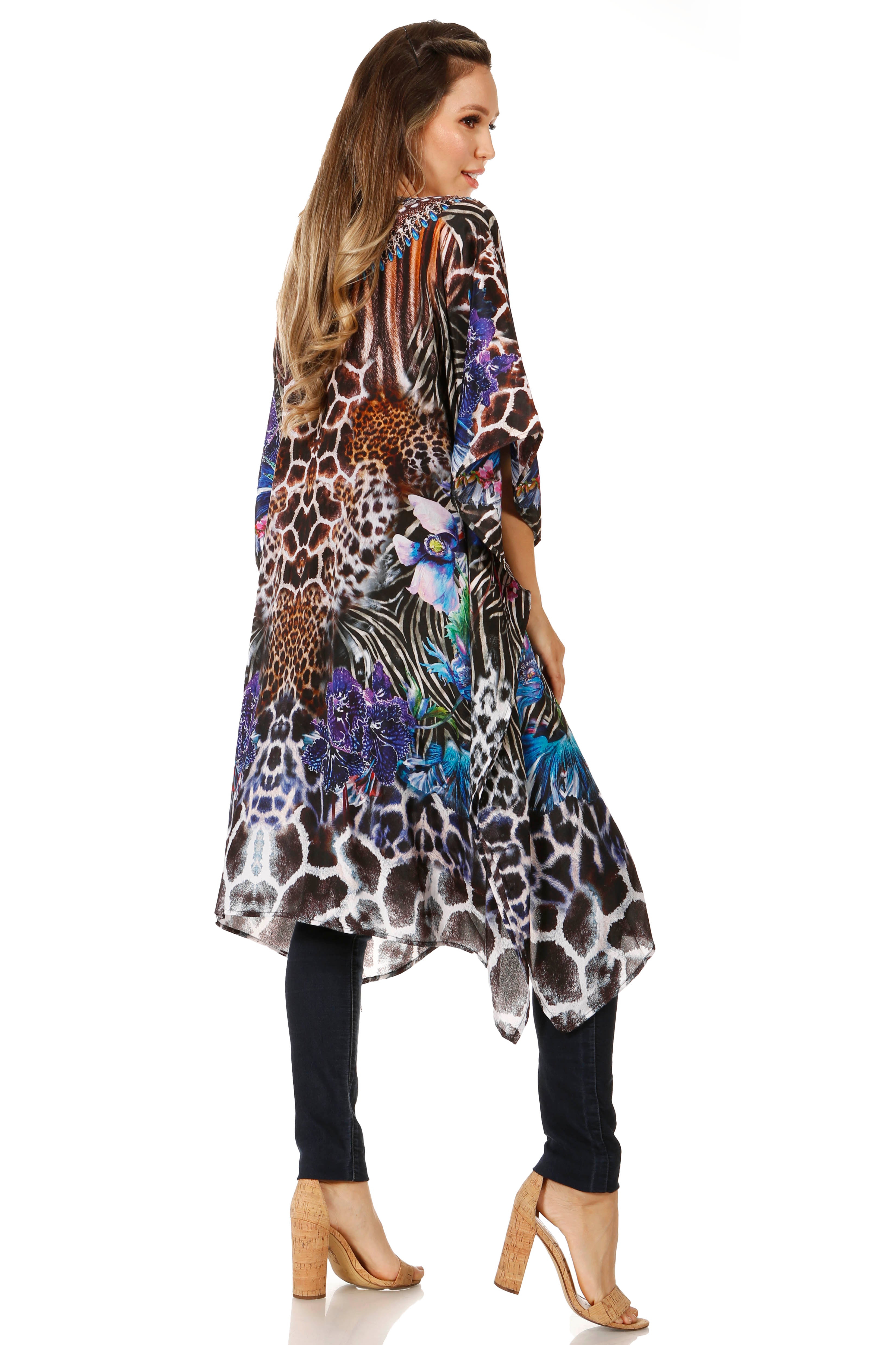 Woman wearing a colorful patterned dress with a white background