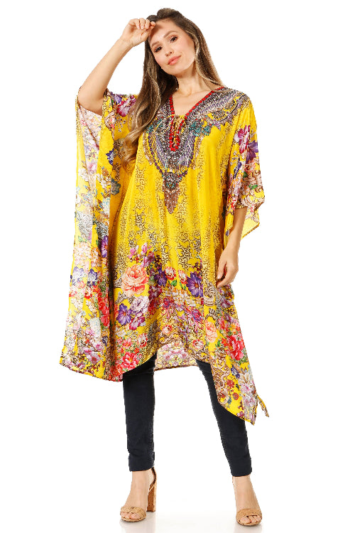 Woman wearing a colorful floral dress with a yellow base on a white background