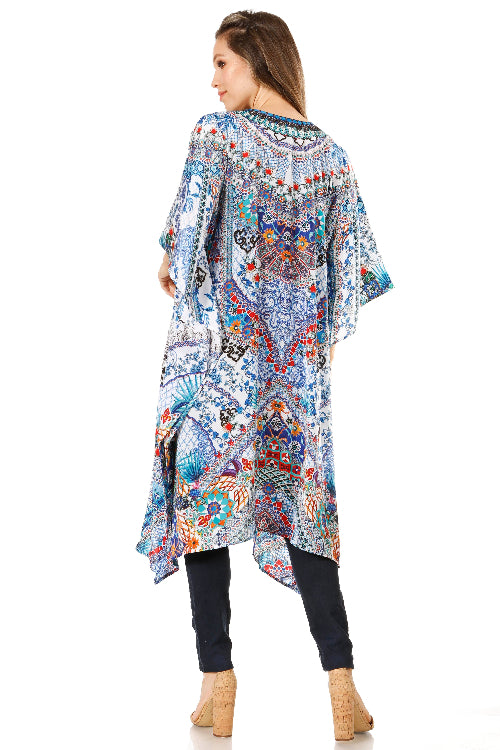 Woman wearing a colorful patterned kimono-style garment on a white background