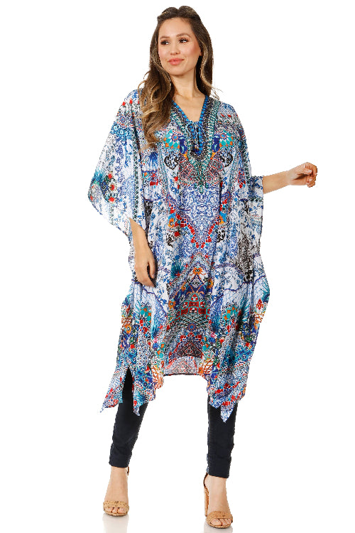Woman wearing a colorful patterned dress on a white background