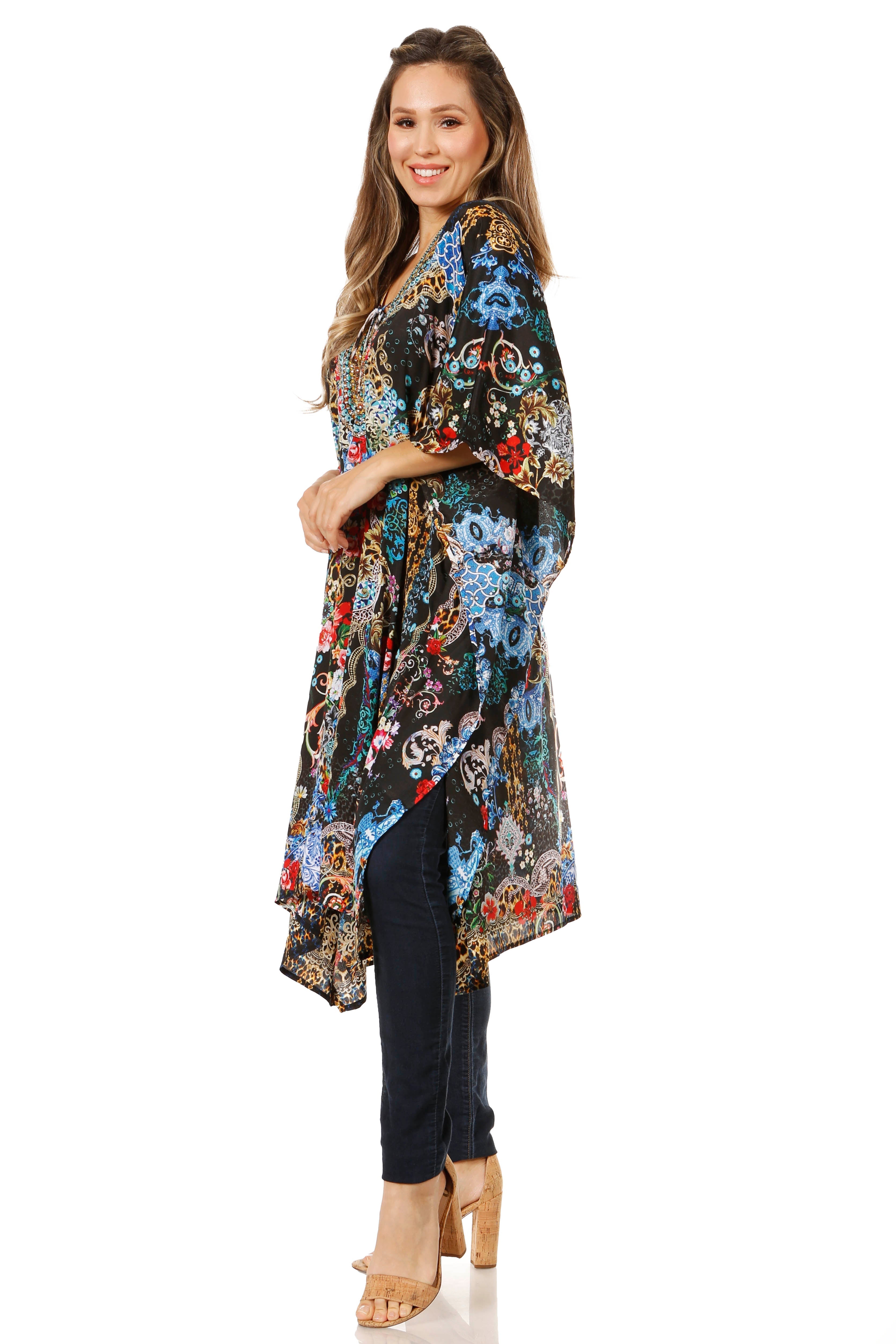 Woman wearing a colorful floral kimono-style garment on a white background