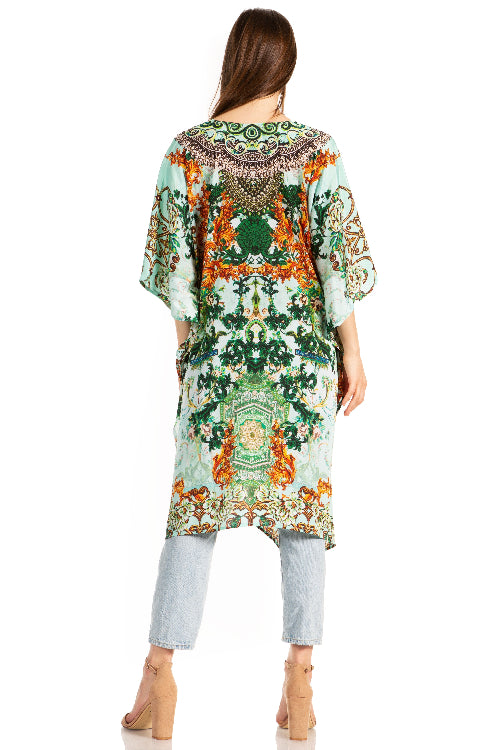 Woman wearing a colorful patterned dress with a white background