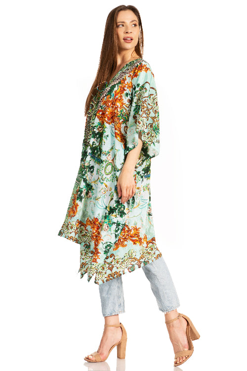 Woman wearing a floral kimono-style garment on a white background