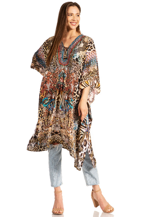 Woman wearing a long, patterned dress with a white background