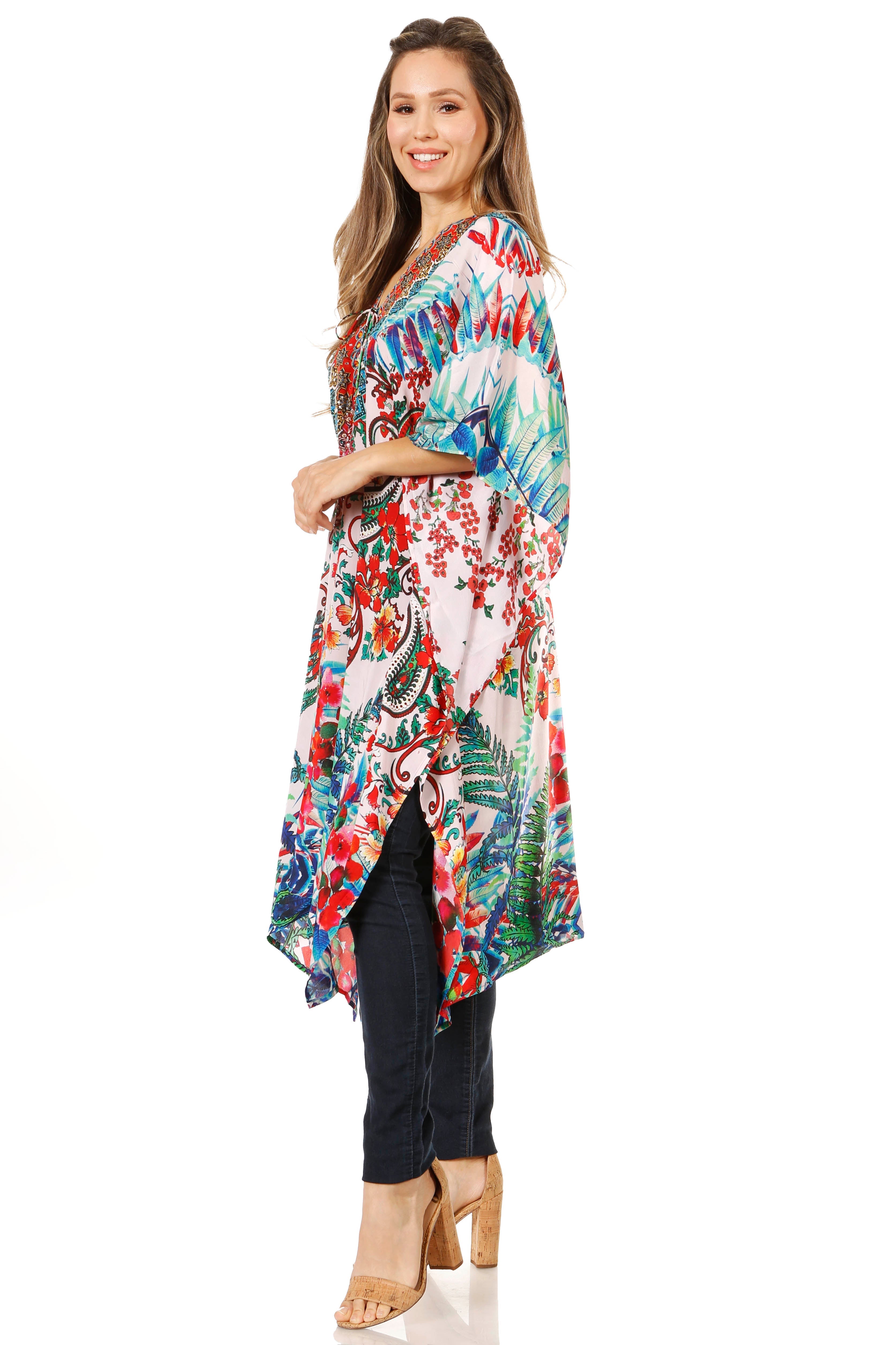 Woman wearing a colorful floral kimono-style top on a white background