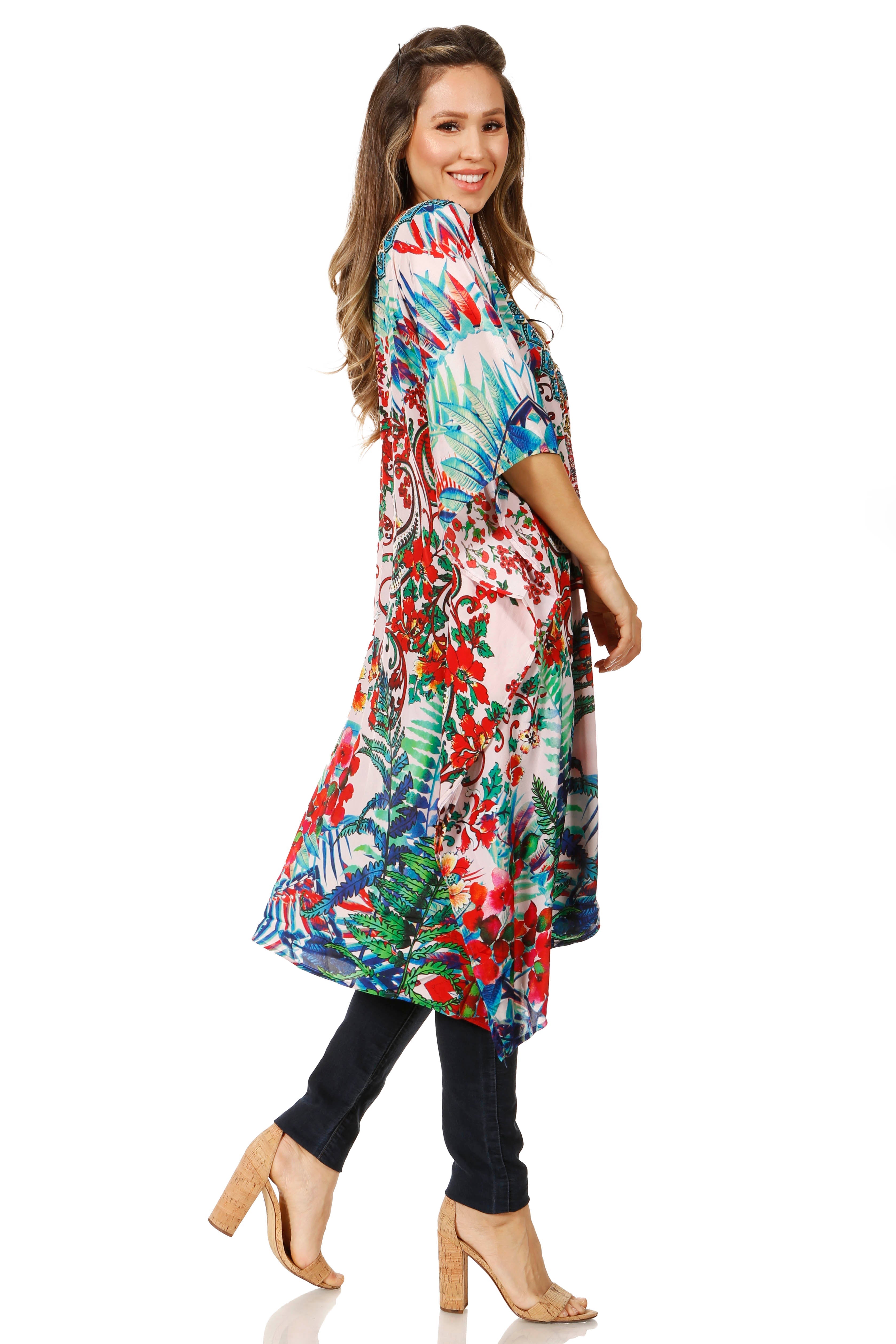 Woman wearing a colorful floral dress on a white background