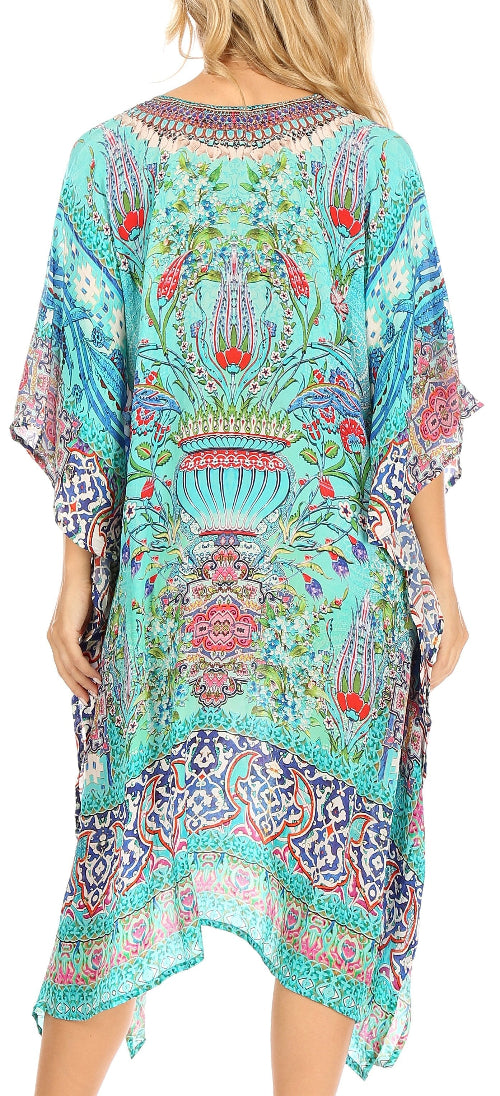 Woman wearing a colorful patterned dress with a floral design.