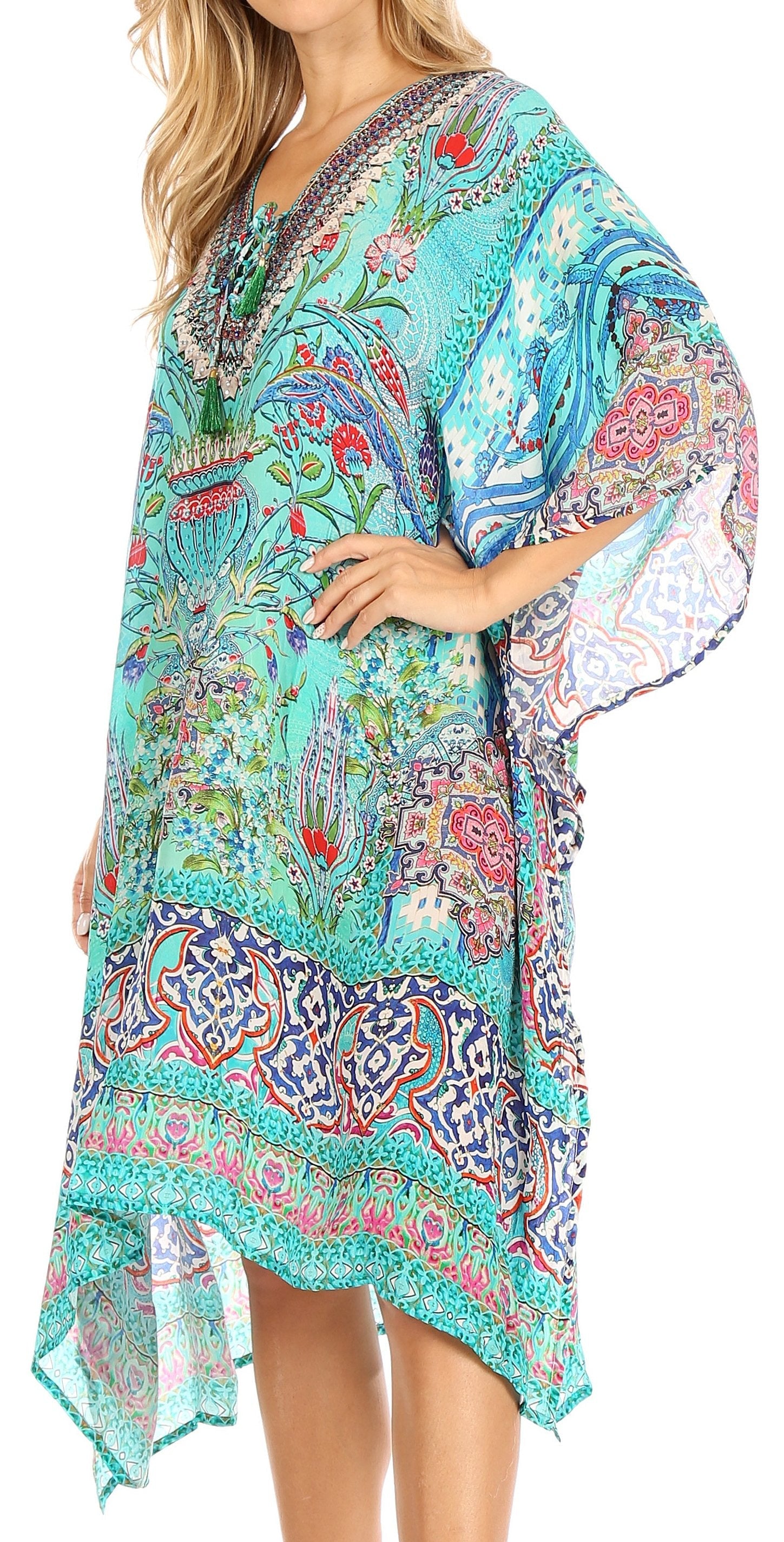 Woman wearing a colorful patterned dress with a white background