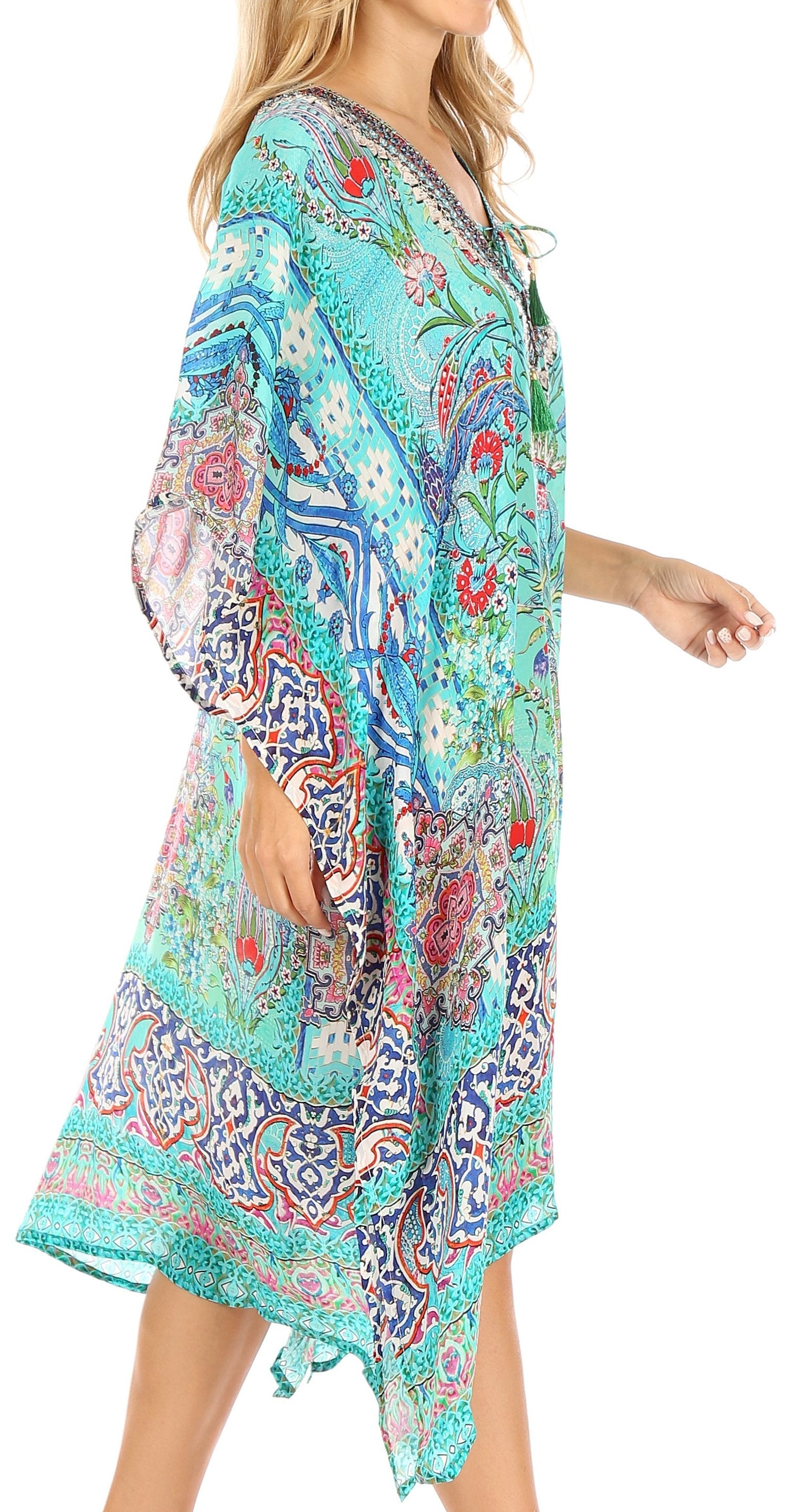 Woman wearing a colorful patterned dress on a white background