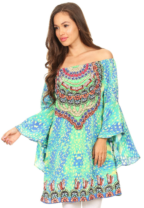 Woman wearing a colorful off-shoulder dress with bell sleeves on a white background