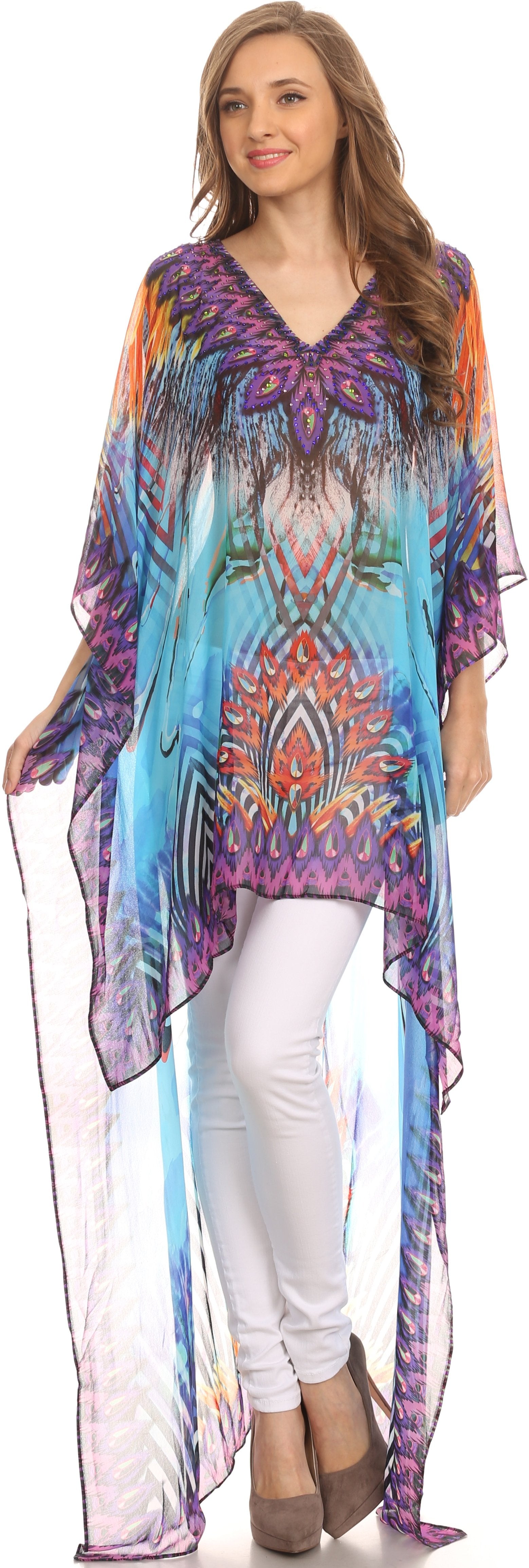 Woman wearing a colorful patterned kimono over a white outfit on a plain background