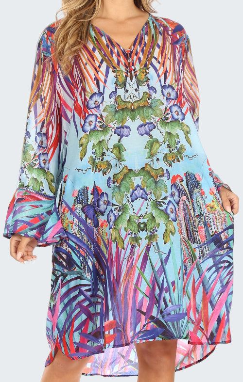 Colorful patterned dress with long sleeves on a white background