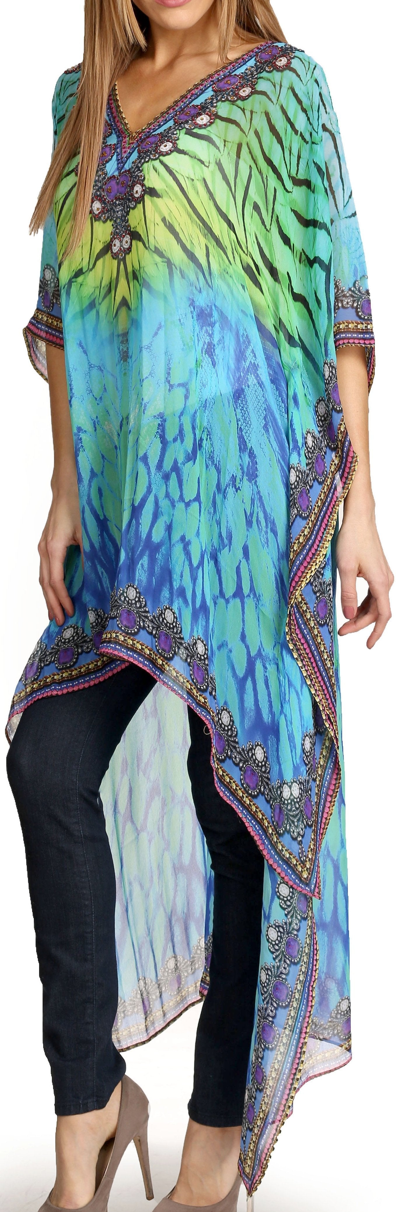 Woman wearing a colorful tie-dye dress with a patterned hem.