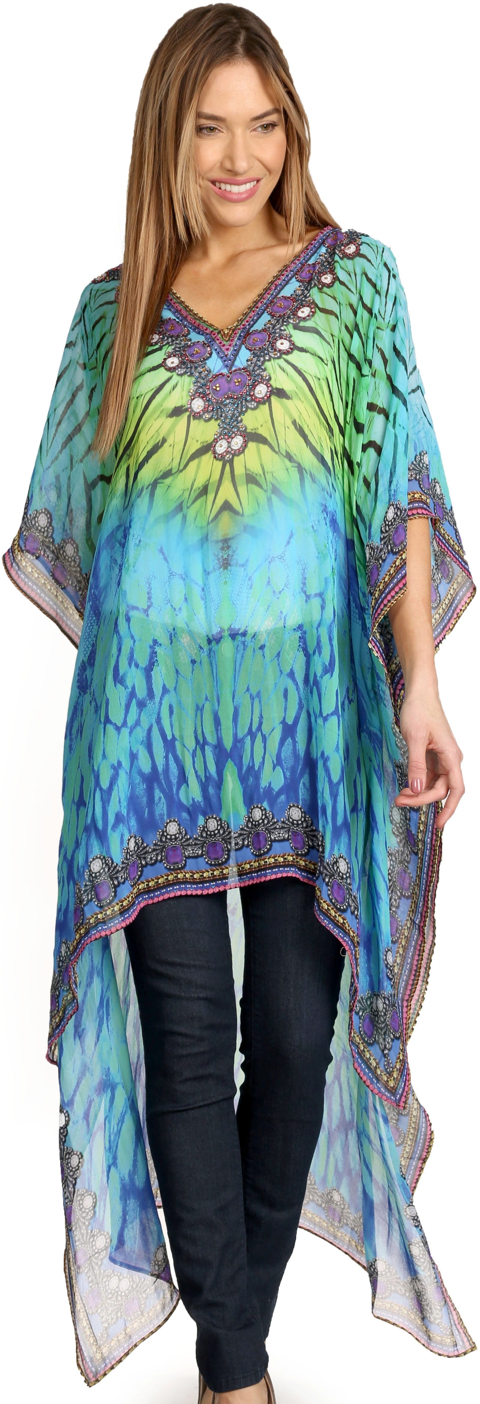 Woman wearing a colorful tie-dye kimono-style top with a vibrant pattern.