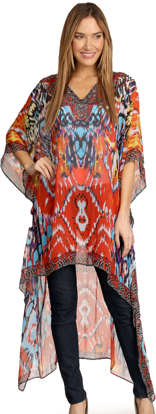 Woman wearing a colorful patterned dress with black pants on a white background