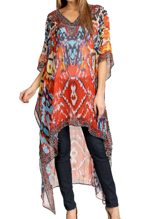 Woman wearing a colorful patterned dress with a white background