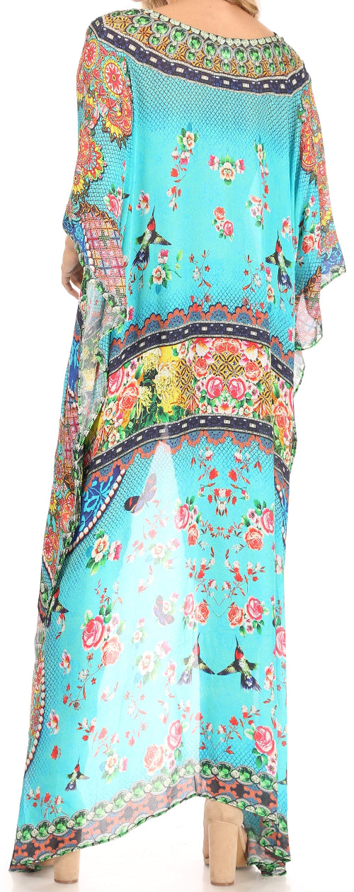 Colorful floral and abstract patterned dress on a turquoise background