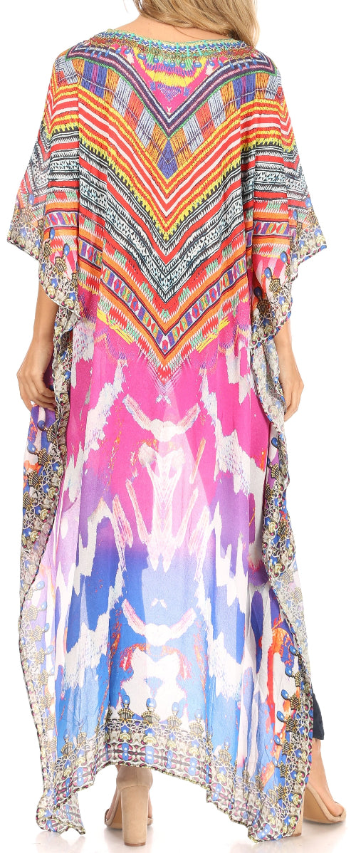 Colorful patterned kaftan worn by a model on a plain background