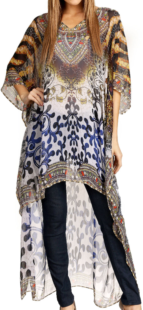 Woman wearing a long, patterned dress over black pants on a white background