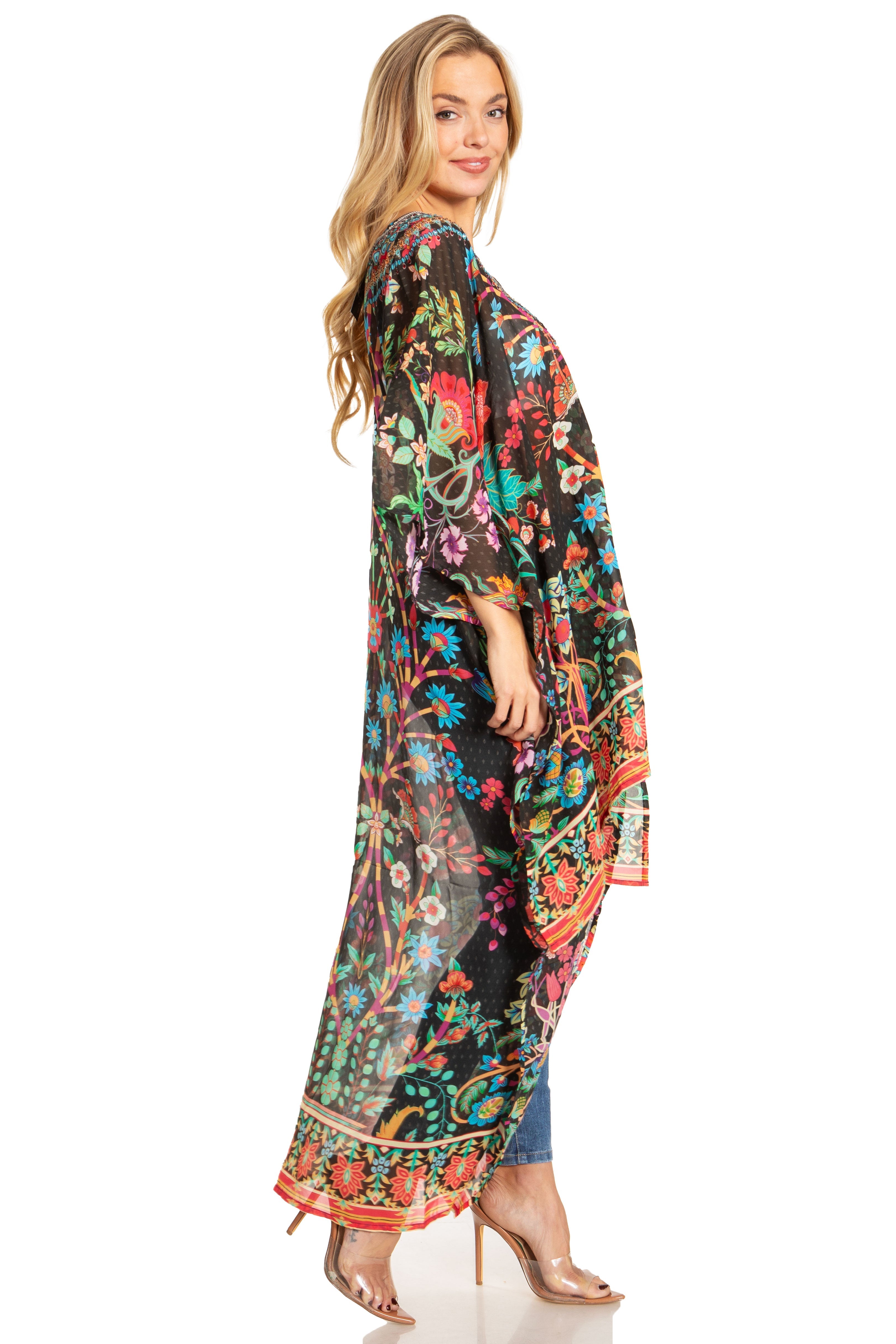 Woman wearing a colorful floral kimono-style garment on a white background
